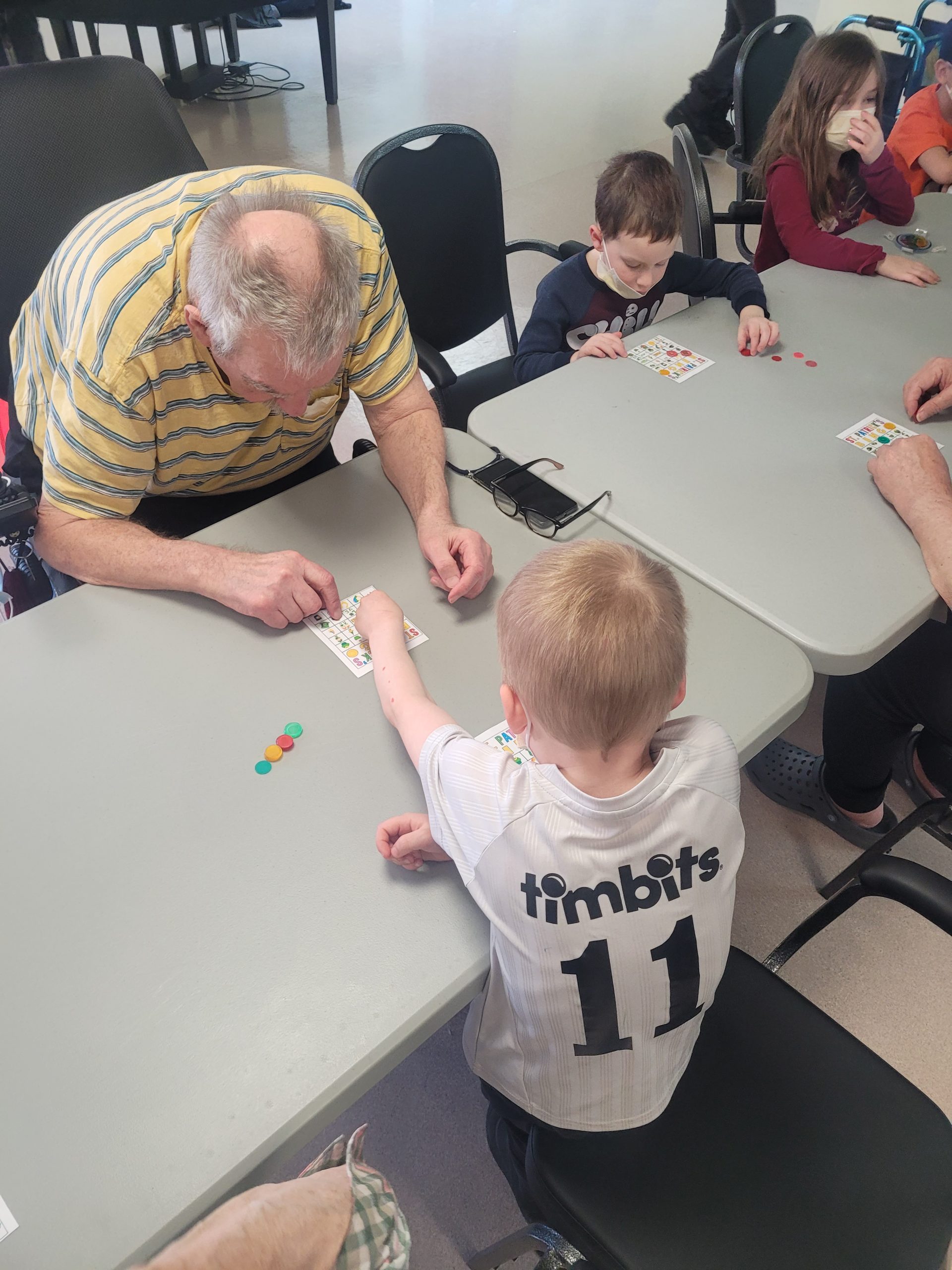 Barkers Point Elementary School students played Bingo, made bracelets, and sang songs to residents at Fredericton's York Care Centre (YCC) nursing home during two March visits.