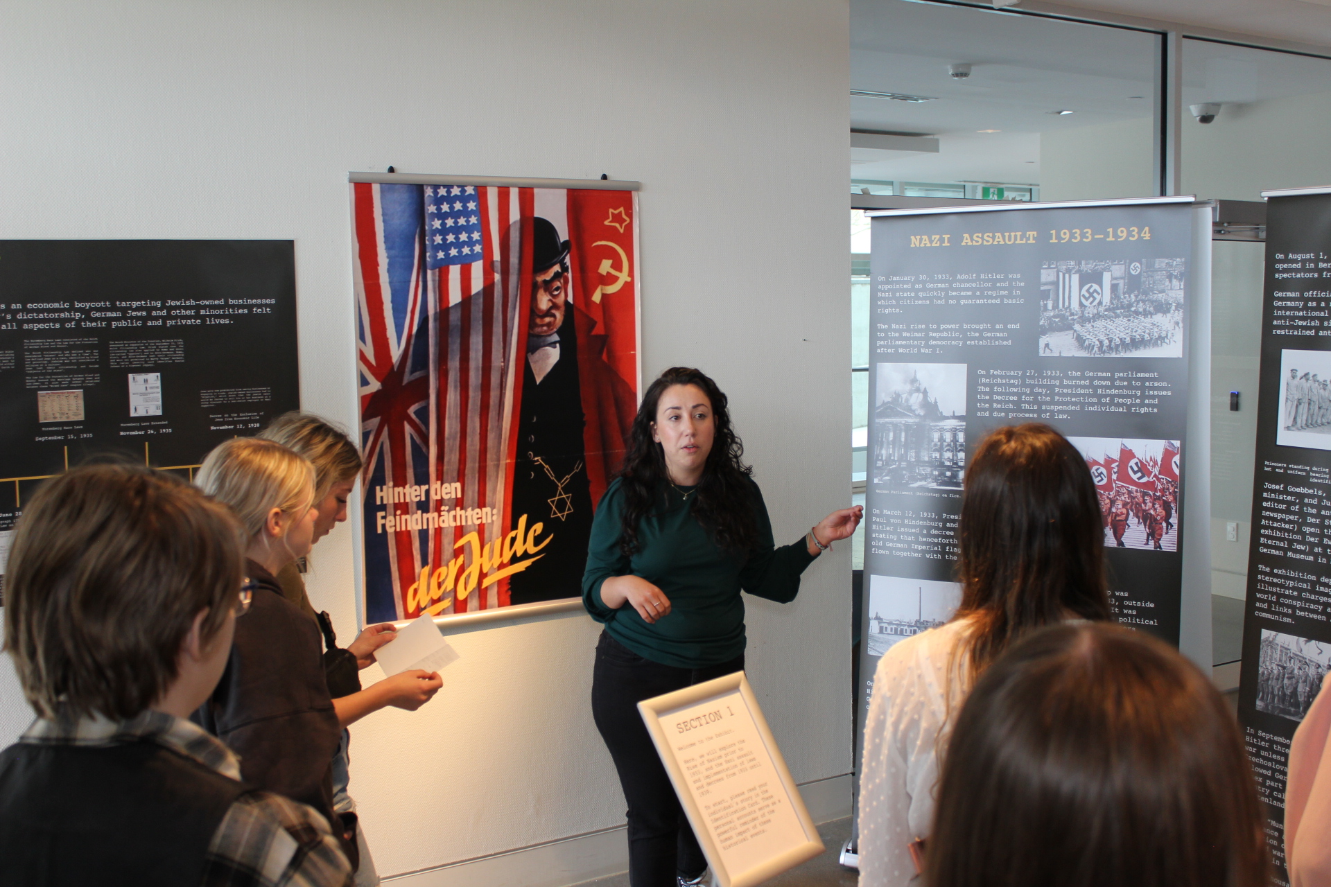 Holocaust exhibit director Jasmine Kranat speaks to Harvey High School students about the Holocaust at the Beaverbrook Art Gallery on Wednesday, May 17, 2023.