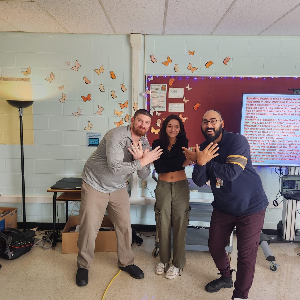 Enterprise Center staff and a student demonstrate their commitment to the Orange Butterfly Wishes initiative, in honour of the National Day of Truth and Reconciliation.. 