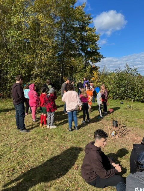Cambridge-Narrows Community School students plant multiple trees on Take Me Outside Day, Oct. 18, 2023.
