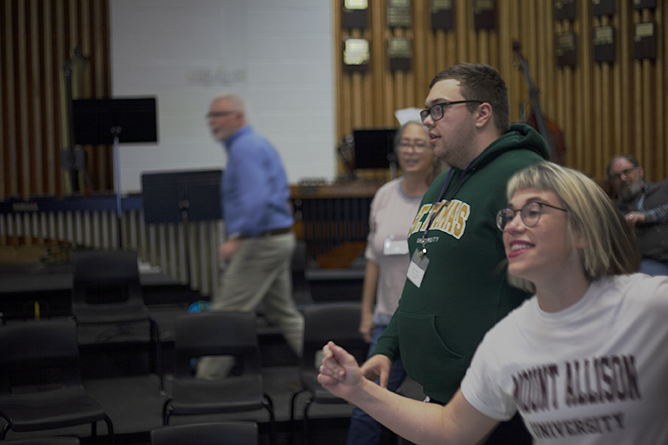 Kiera Galway, Mount Allison University’s Assistant Professor of Music Education and Choral Conducting, leading teachers in a dance during her 'Engaging K-12 Choral Activities' presentation.