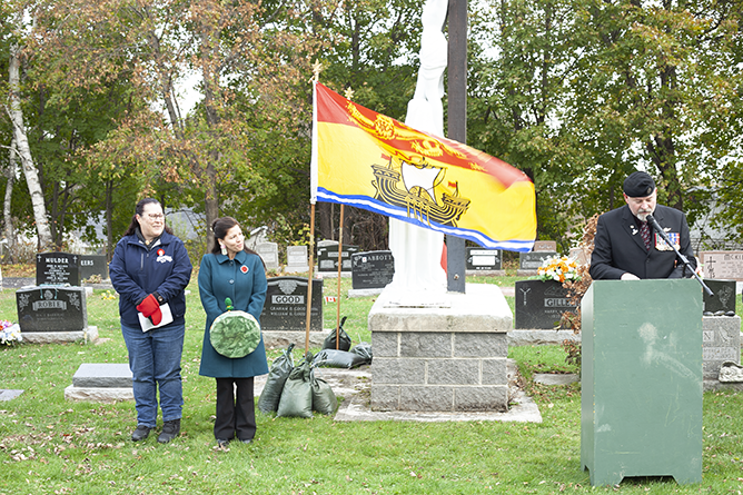 (l-r) Harold Peterson Middle School Social Studies Teacher Pam Thomas, ASD-W  Director of First Nations Culture & Programs Sarah Francis, and CFB Gagetown Range Control Officer Maj. Dan Hone at the No Stone Left Alone ceremony, St. Vincent de Paul Cemetery in Oromocto on Nov. 9, 2023.