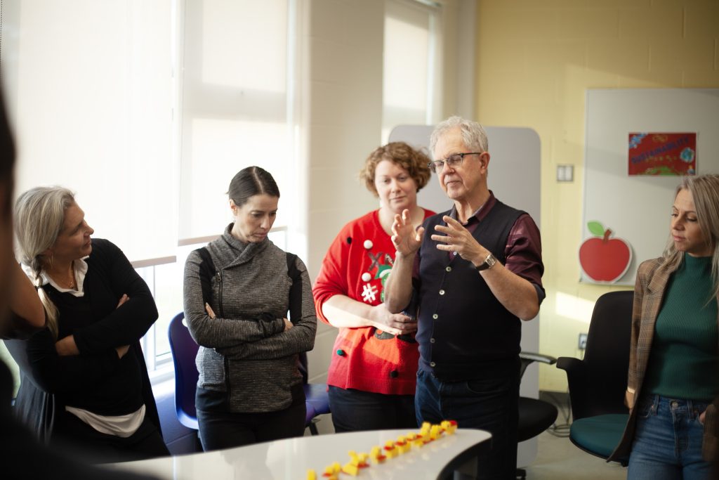 CPSN principal investigators Andy Hargreaves (centre right) and Trista Hollweck (left) speak to regional educators about the power of play in learning at the Playful Schools Atlantic Gathering in Education, Friday, Dec. 1, at Hanwell Park Academy.