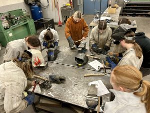 Female students at Carleton North High School do metal work during a Women-in-Trades event at the school on April 12.