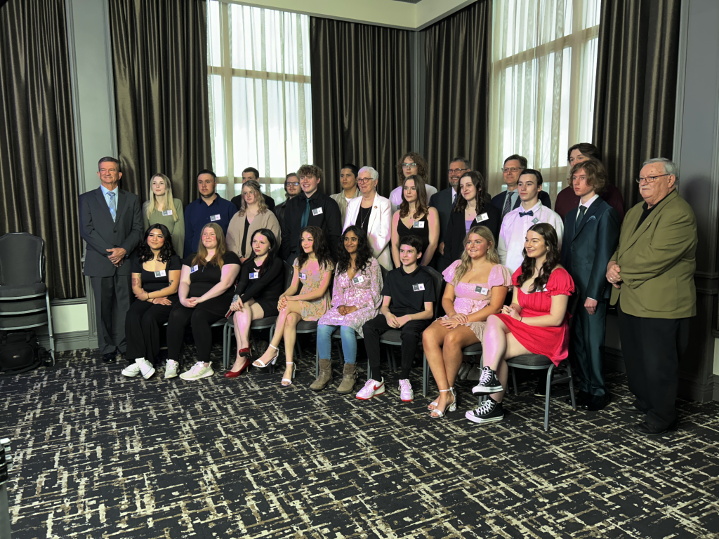 The 2024 Kingswood Turnaround Achievement Award winners with New Brunswick Lt.-Gov. Brenda Murphy (centre, whiter jacket), Kingswood President Brian Johnson (far left), Education and Early Childhood Development Minister Bill Hogan (back row, third from right), and Anglophone School District West Superintendent David McTimoney (back row, second from right).
