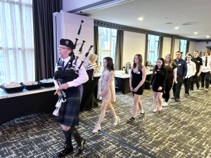 Piper Austin Chapman leads a procession of Kingswood Turnaround Achievement Award winners into the awards ceremony at Fredericton's Crowne Plaza-Lord Beaverbrook hotel on Wednesday, May 8.