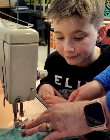 Keswick Ridge School Grade 3 student Grayden Keddy learns to sew.
