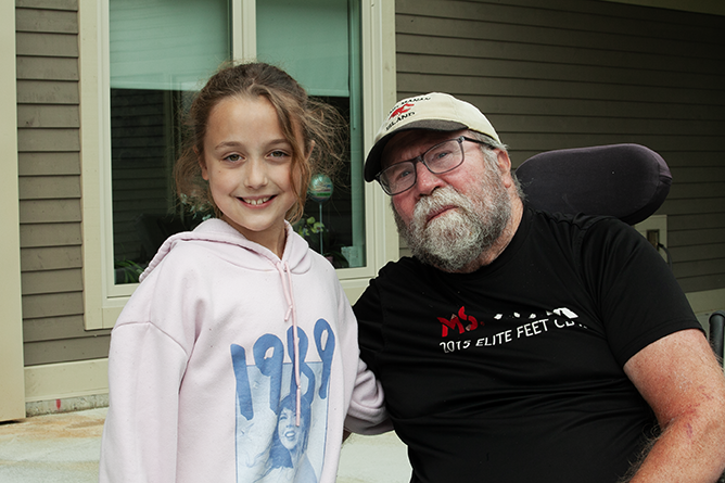 Neill Hall resident Jim Eddington with his granddaughter Willow Boudreau, a Grade 3 student at Gibson Neill Memorial Elementary School. Eddington is an avid gardener who would have Willow help him and his wife in their home garden.