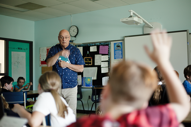 ASD-W Digital Learning Lead Jeff Whipple talks to Nashwaak Valley School students about their technology passports.
