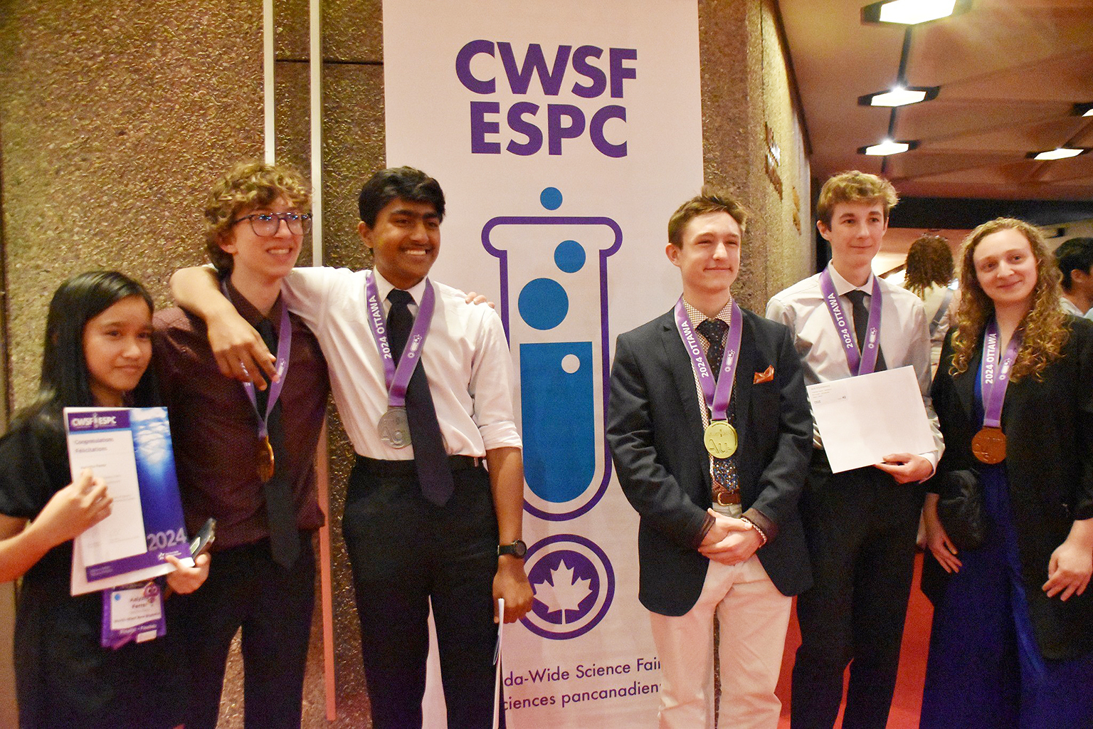 Onkit Saha (third from left) and Jack D'Entremont (second from right), stand with other participants in the 2024 Canada-wide Science Fair held in Ottawa from May 26 - 31.