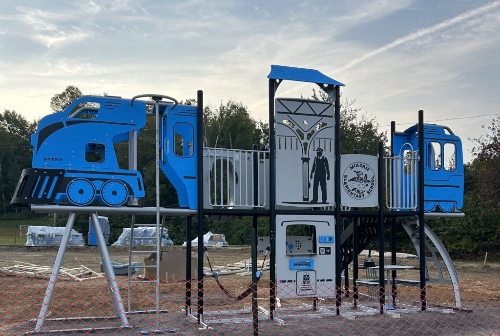 A train-themed play structure, a reminder of McAdam's recent past as a prominent Maritime railroad town, is one of the new equipment items installed on McAdam Elementary School's refurbished playground.