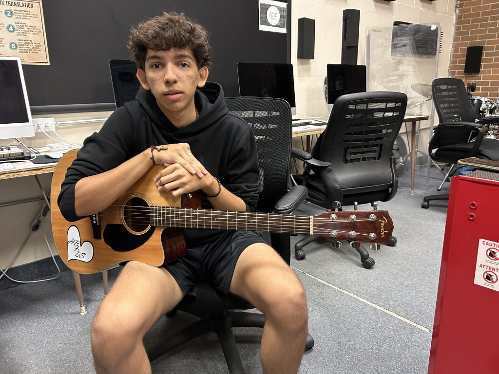 Pietro Taveiraboza, a Fredericton High School Grade 12 student and guitarist.