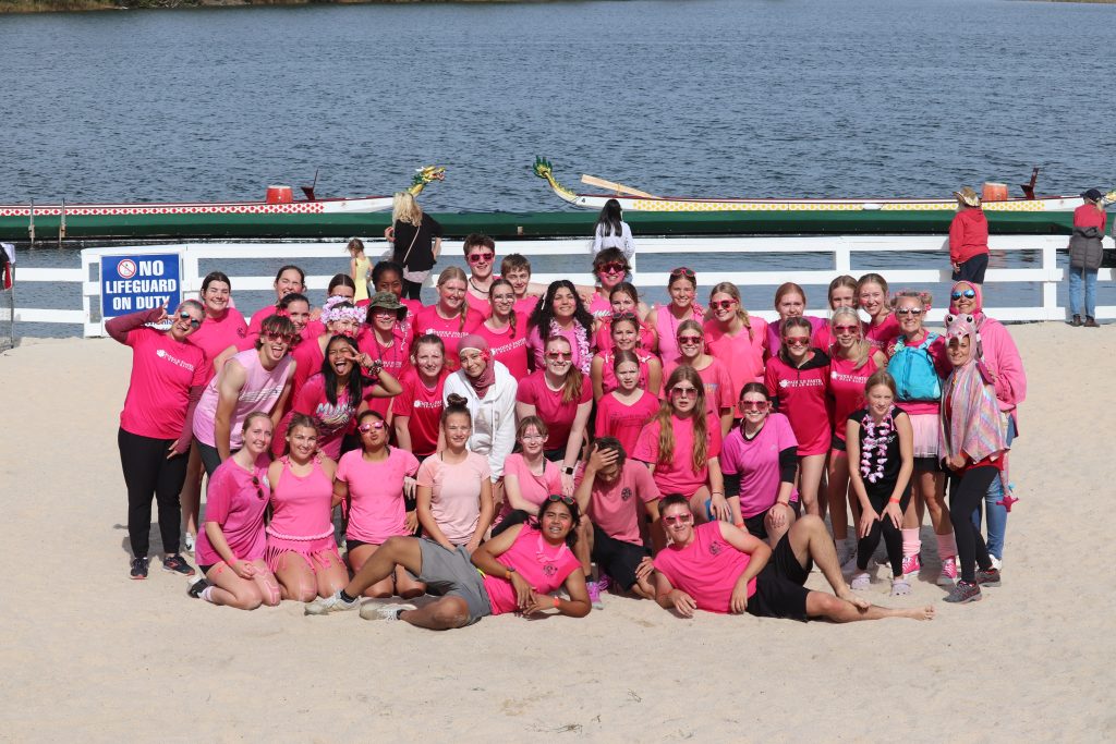 Teacher Lisa Porter (right, in blue life vest) with her Woodstock High School dragon boat team.