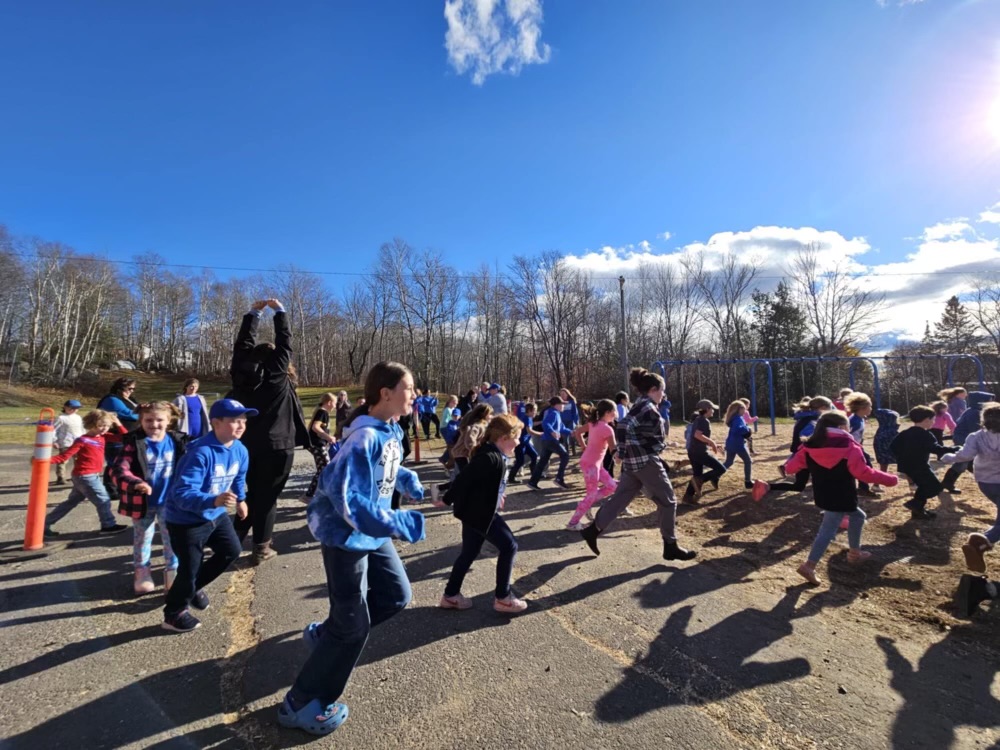 Students run to the refurbished McAdam Elementary School playground on Thursday, Nov. 7.