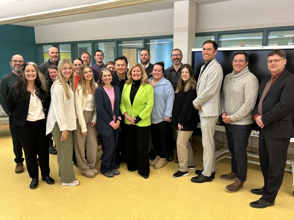 Sen. Krista Ross poses with district teachers and administrators following her talk on Tuesday, Jan. 21 at Bliss Carman Middle School.