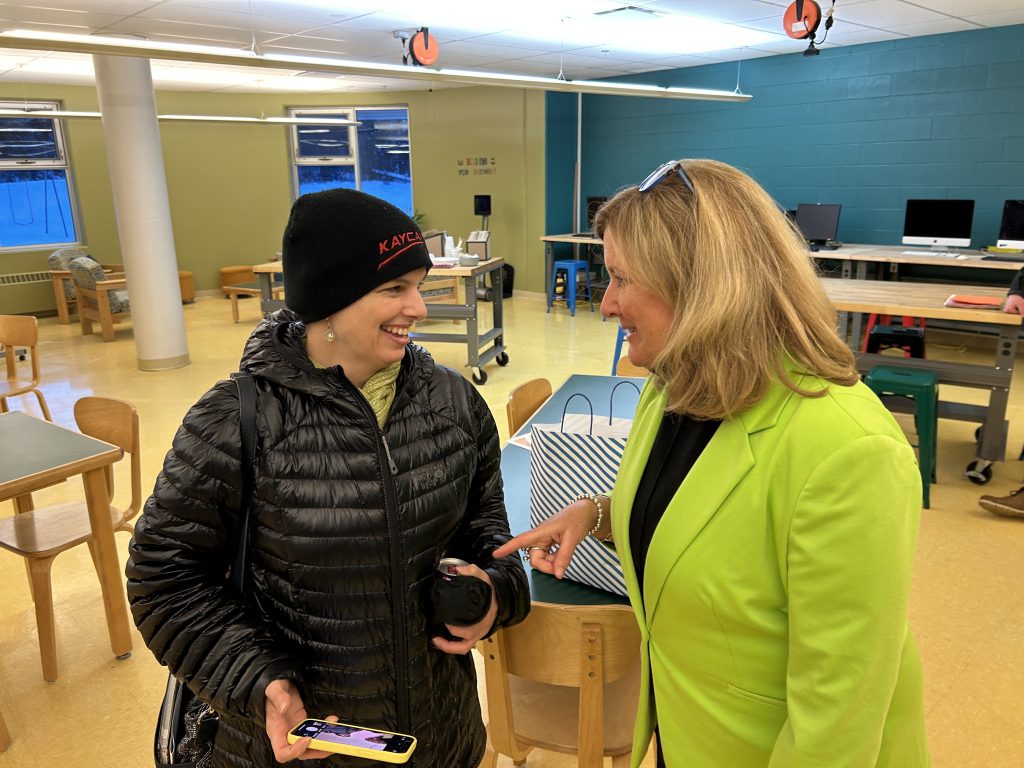 Fredericton High School Grade 9 social studies and resource teacher Diane Leroux speaks with Sen. Krista Ross on Tuesday, Jan 21 at Bliss Carman Middle School.