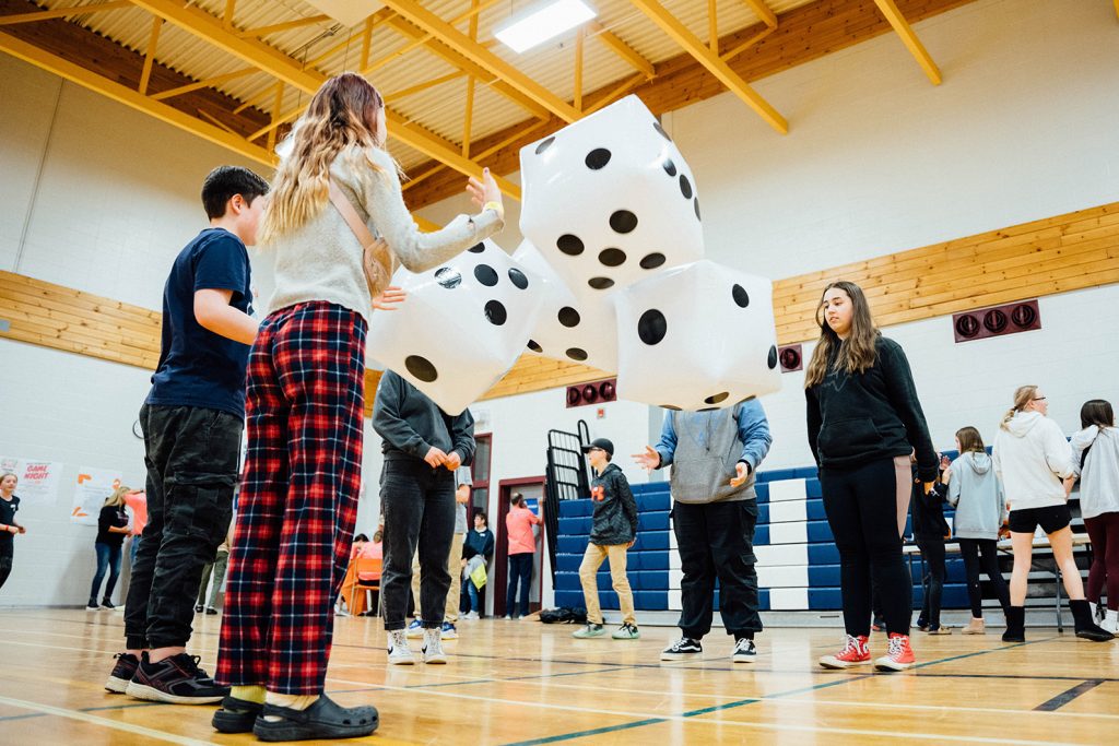 Students from Townsview School and Meduxnekeag Consolidated School have fun at a family game night last April, as part of Planet Youth drug and alcohol abuse prevention activities. Members of the Woodstock High School Planet Youth student club planned the event. Photo Credit: Alyson Ross.