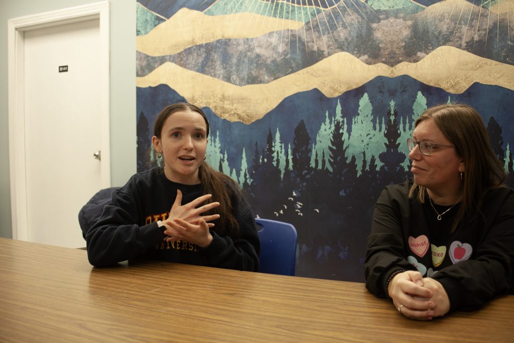 (L-R) Planet Youth student club president Ainsley McGuinness and Townsview and Meduxnekeag Consolidated schools Community Coordinator JoAnn Boone discuss Planet Youth initiatives.