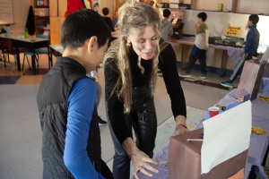 Teacher Kristen Nixon works with a student at the games arcade her class created at Connaught Street School.