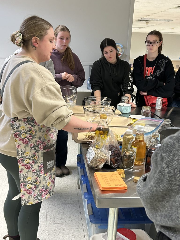 Fredericton Delta Hotel chef, and Nackawic High School graduate, Katrina Jones leads the Cooking with Dairy learning session for students at Fenwick Farms on Wednesday, March 26.