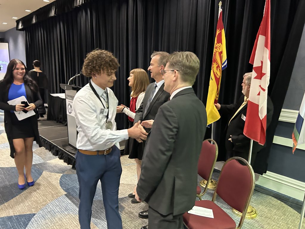 Grade 12 Fredericton High School (FHS) student Peyton Bernard Perley and FHS teacher Abigail Fox greet NB Education Minister Claire Johnson, Kingswood Past President Brian Johnson, and ASD-W Superintendent David McTimoney at last night's Turnaround Achievement Awards ceremony at the Fredericton Inn.