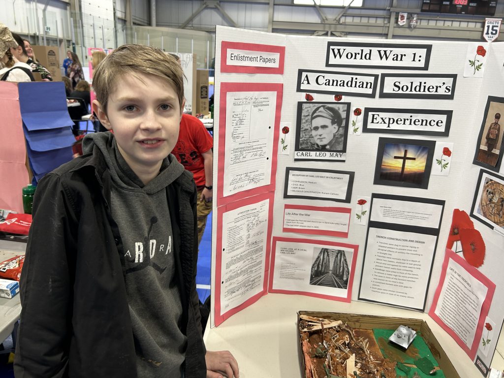 Keswick Ridge School Grade 7 student Dakota Bilow presents a project on his great-great-grandfather Carl Leo May, a First World War veteran, at the 2025 Regional Heritage Fair at Fredericton's Grant Harvey Centre, on Wednesday, May 7.