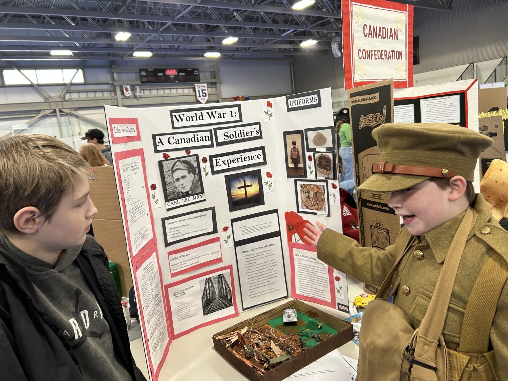 Keswick Ridge School Grade 7 student Dakota Bilow presents a project on his great-great-grandfather Carl Leo May, a First World War veteran, at the 2025 Regional Heritage Fair at Fredericton's Grant Harvey Centre, on Wednesday, May 7. Bilow and his project partner Grayden Keddy, Grade 4, did a deep dive into First World War history to create their display.