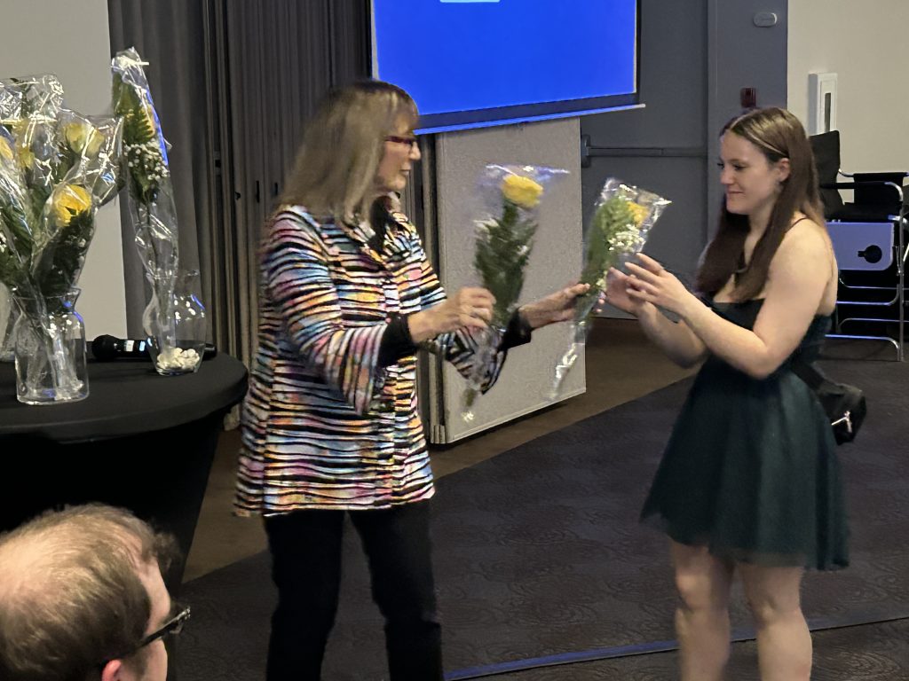 Betty Lou Craig, co-owner of Craig Manufacturing, presents flowers to Nackawic Middle School Grade 8 student Mya Brooks-Lisoway at the Craig Turnaround Achievement Awards ceremony at the Woodstock Best Western on Wednesday, May, 21.