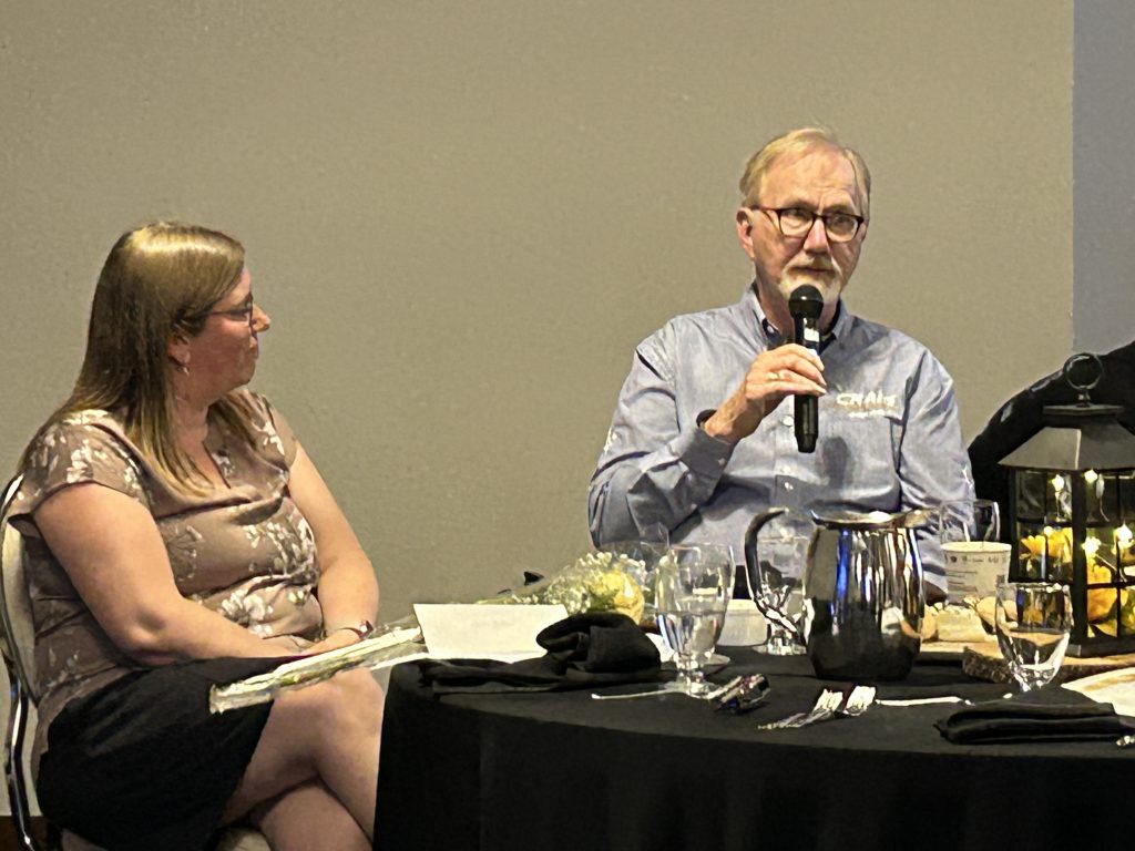 John Craig, co-owner of Craig Manufacturing, addresses the honourees as ASD-W Community School Engagement Coordinator JoAnn Boone looks on.