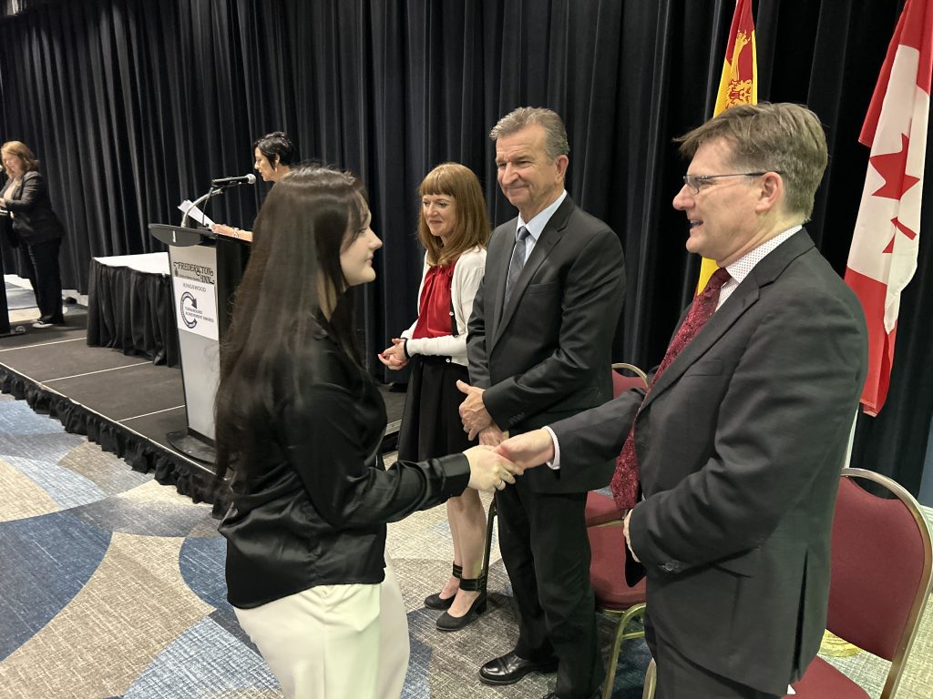 Fredericton High School Grade 12 student Hannah Michaud greets NB Education Minister Claire Johnson, Kingswood Past President Brian Johnson, and ASD-W Superintendent David McTimoney at last night's Turnaround Achievement Awards ceremony at the Fredericton Inn.
