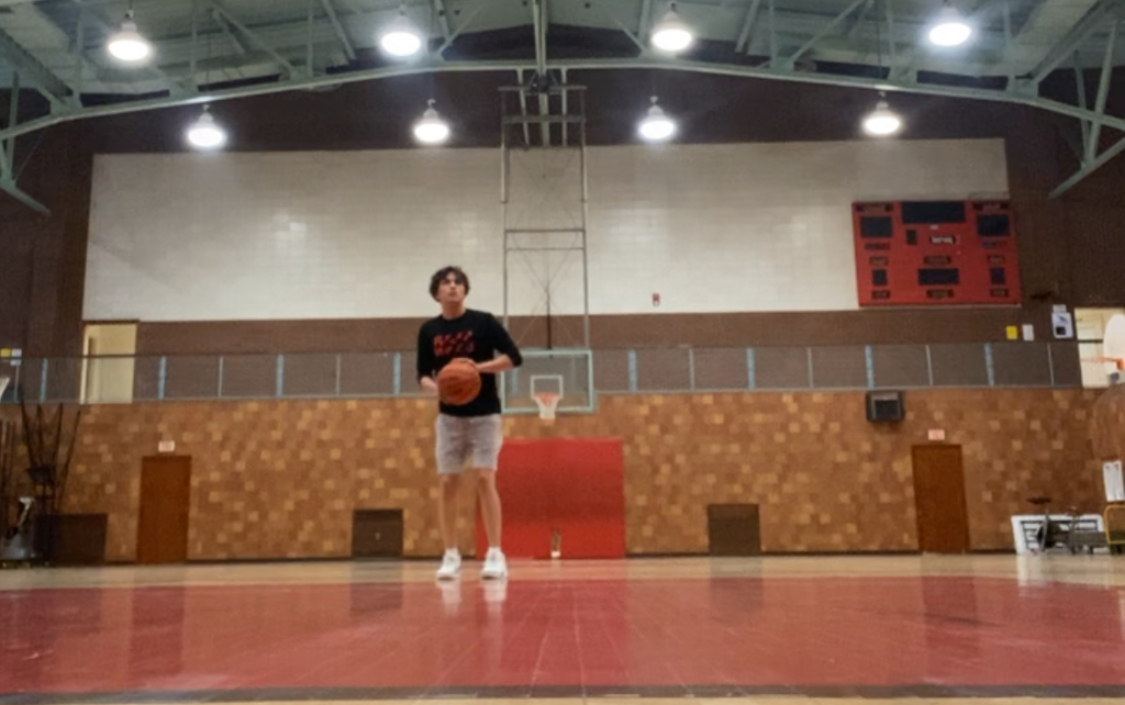 Grade 12 Fredericton High School student Peyton Bernard Perley playing basketball, one of his favourite sports.